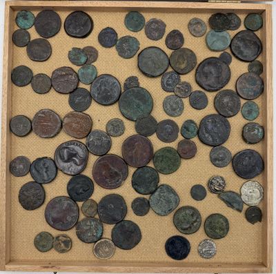 an image of a box filled with lots of coins on top of a table