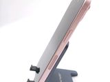 a cell phone that is sitting on top of a stand