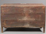 an old wooden chest sitting on top of a gray floor