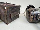 two old cameras sitting next to each other on a table
