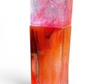 a pink and orange soap sitting on top of a white surface