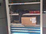a metal cabinet with blue drawers inside of it