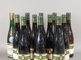 six bottles of wine are lined up in a row on a table