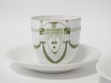a cup and saucer with a design on it