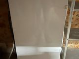 an image of a white refrigerator in a room