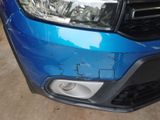 a close up of the front of a blue car