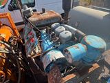 a truck that has a engine in the back of it