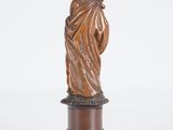 a statue of a woman holding a child on a pedestal