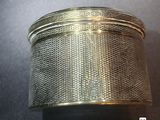an image of a close up of a metal container on a table