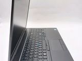 a laptop computer sitting on top of a white table