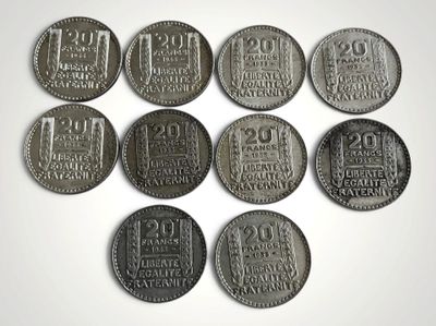 six types de pièces différents sont présentés sur une surface blanche