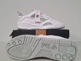 a pair of white sneakers on top of a box