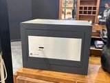 a microwave sitting on top of a wooden table