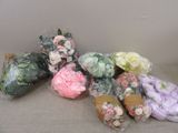many different types of flowers wrapped in plastic bags