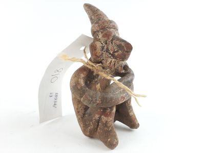 an image of a figurine of a man with a hat on his head