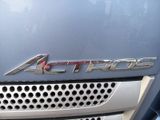 a close up of the front of a car with a chrome emblem