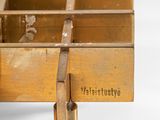 an old wooden box with a padlock on top of it