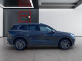a blue 2020 lincoln suv parked in a showroom