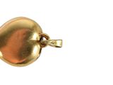 an image of a gold heart charm on a white background
