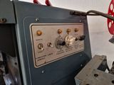 an image of a machine that is working on a piece of metal