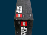 a lego star wars box sitting on a blue surface