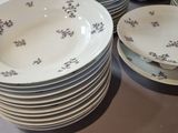 a lot of plates that are sitting on a table