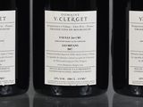three bottles of wine sitting on top of a table next to each other