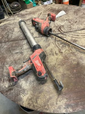 two tools that are sitting on top of a table