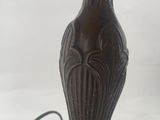 a close up of a table lamp with a glass shade on it