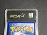 a close up of a pokemon card in a plastic case
