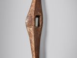 a close up of a wooden object on a wall