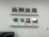three shelves that have pictures on them on them