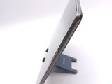 a close up of a cell phone on a stand