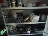 a kitchen shelving with dishes and utensils on it