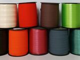 a bunch of spools of different colors of thread