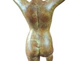 bronze statue of a woman with her hands on her head