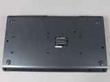 the bottom of a laptop with a small battery on top of it