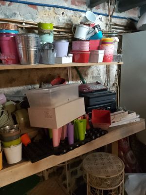 a room with a lot of stuff on the shelves