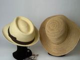 two hats are sitting on top of each other on a table