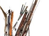 many different types of fishing rods and poles on the ground