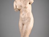 an image of a statue of a woman standing on a pedestal