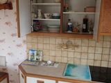a kitchen with a sink and a dishwasher in it