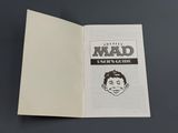 an open book with a drawing of a man ' s face on it