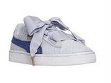 a white and blue sneaker with a bow on it