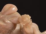 a statue of a man holding a baby in his arms