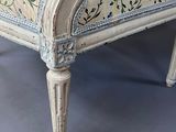 a white chair with a floral upholstered seat
