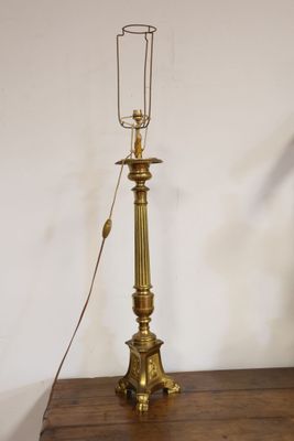 a lamp that is on top of a wooden table