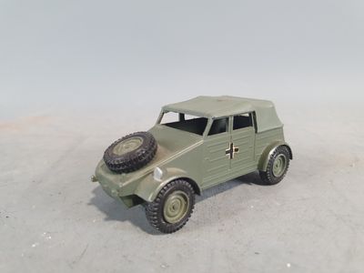 a small toy car with a tire on top of it
