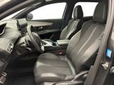 the interior of a car with a steering wheel and leather seats