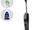 a close up of a vacuum cleaner and a bottle of cleaner